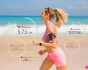 Fit woman running on beach.