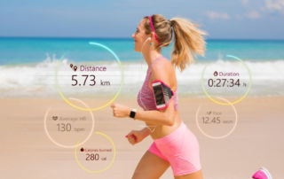 Fit woman running on beach.